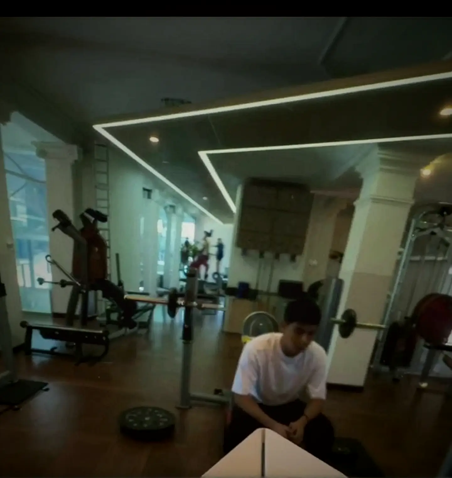OSMO gym hall with white columns, LED ceiling and Technogym equipment